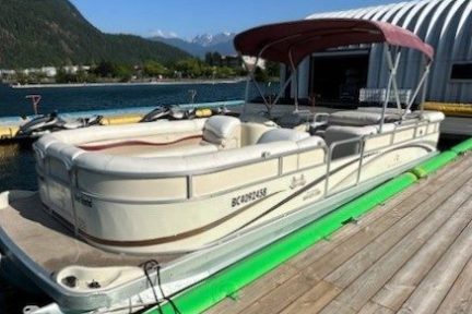 a boat sitting on top of a wooden dock